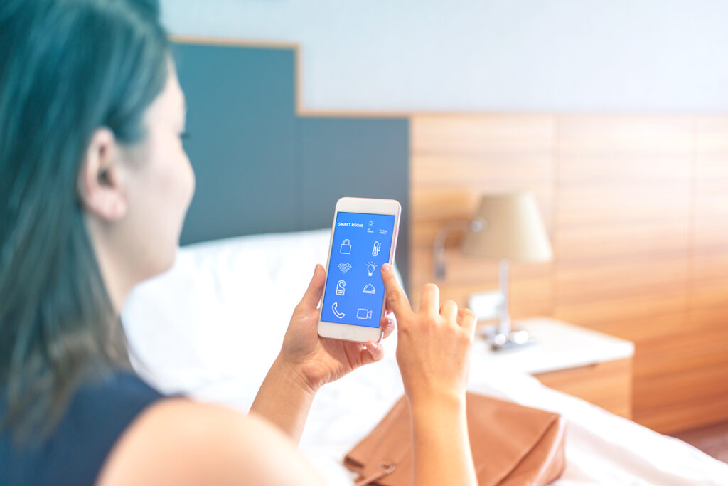 image of a traveler using phone to check in to hotel
