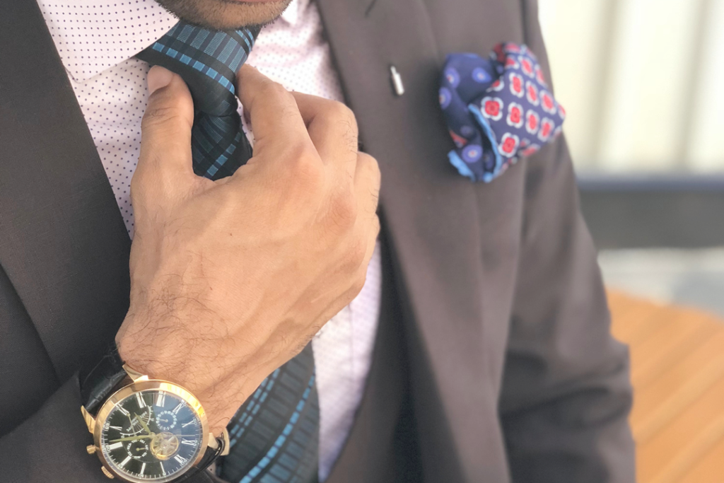 business man adjusting his tie, hotel personalization and flexibility