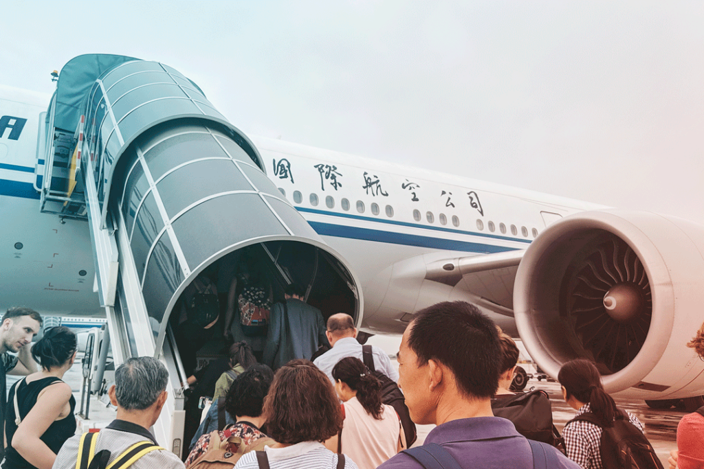 Travelers waiting to board aircraft photo