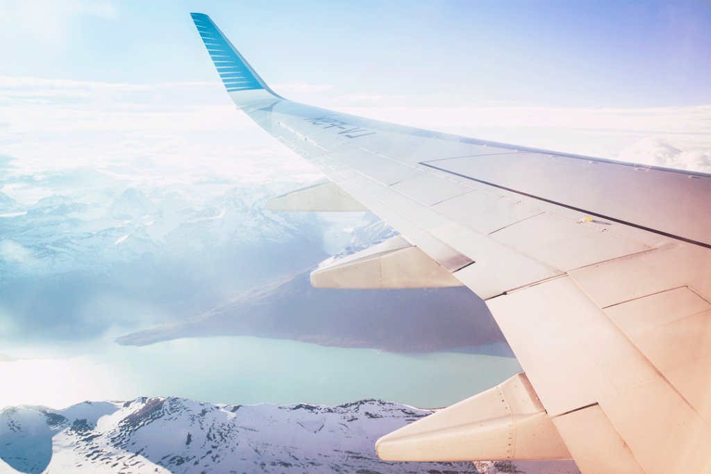 View from plane window overlooking a mountain range
