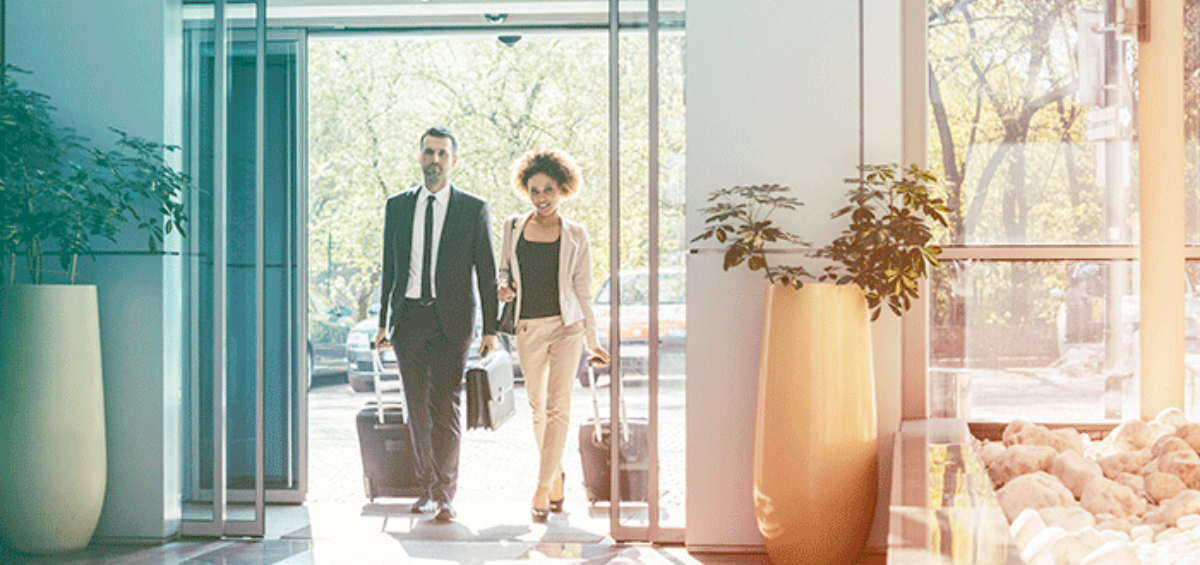 Business People Walking into a Hotel