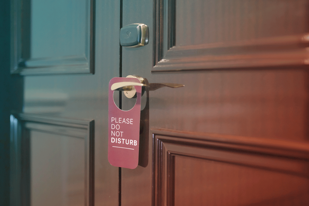 Do not disturb sign on a hotel room door.