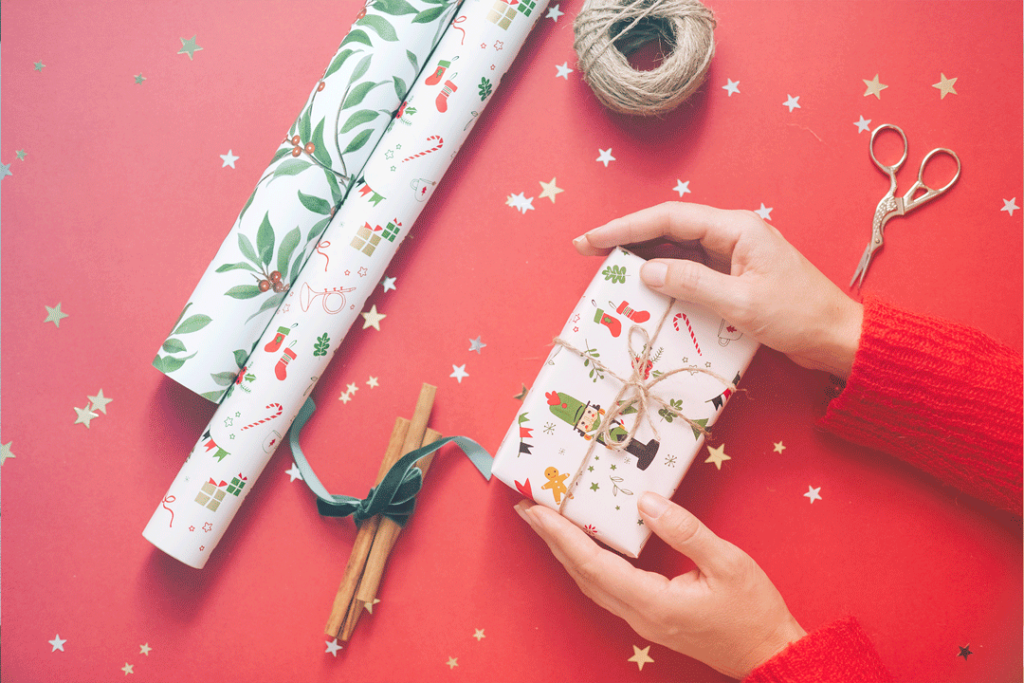 Woman wrapping holiday gifts.