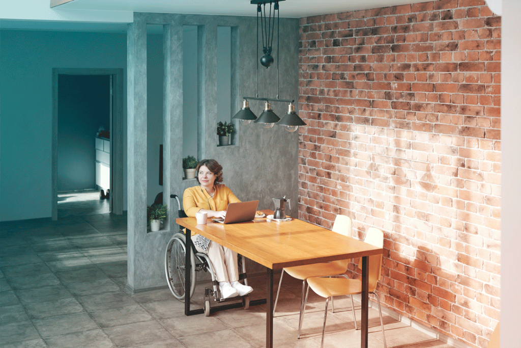Business woman working from her wheelchair accessible home.
