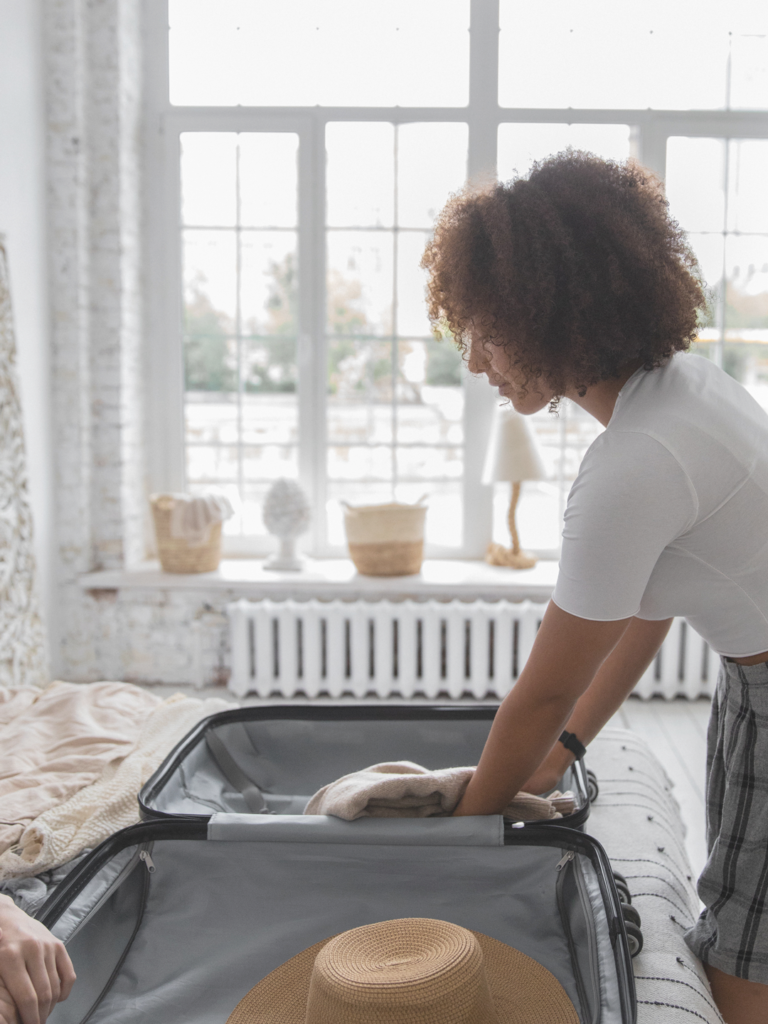 Women packing a suitcase for a trip