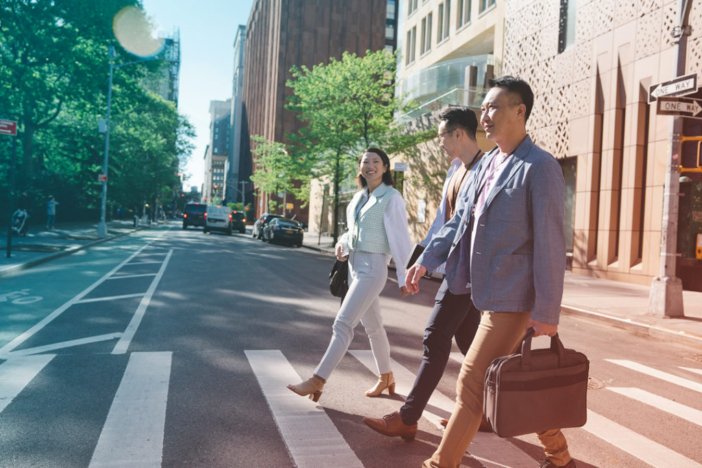 business people walking around a city