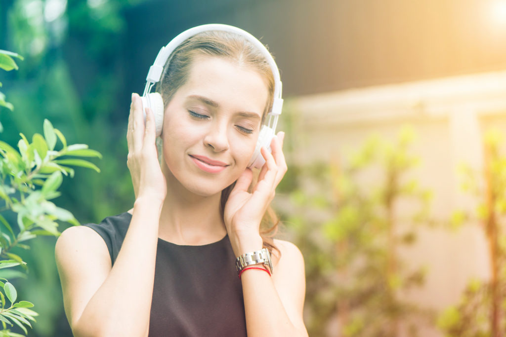 woman wearing noise canceling headphones
