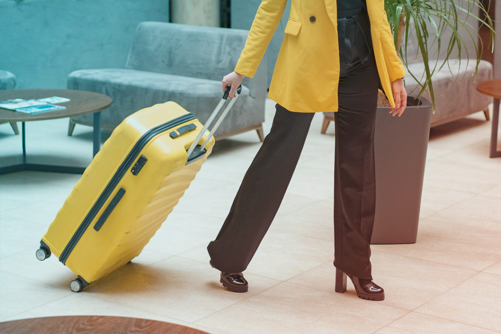Business traveler with suitcase
