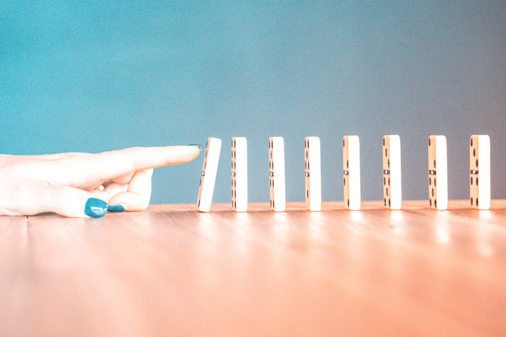 Pushing over stack of Dominos