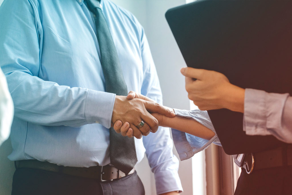 Businessman and women shaking hands