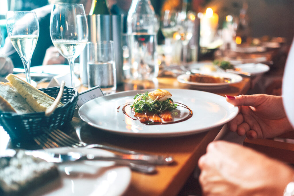 plate of food and a glass of wine