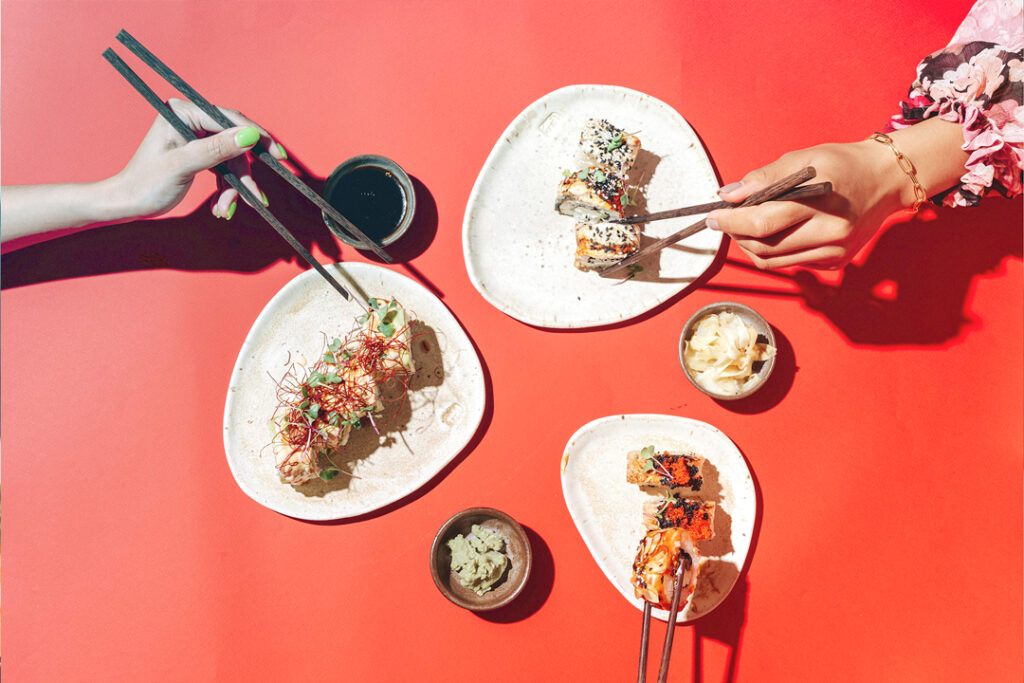 eating sushi with chopsticks