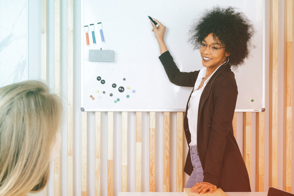 business woman writing on a white board