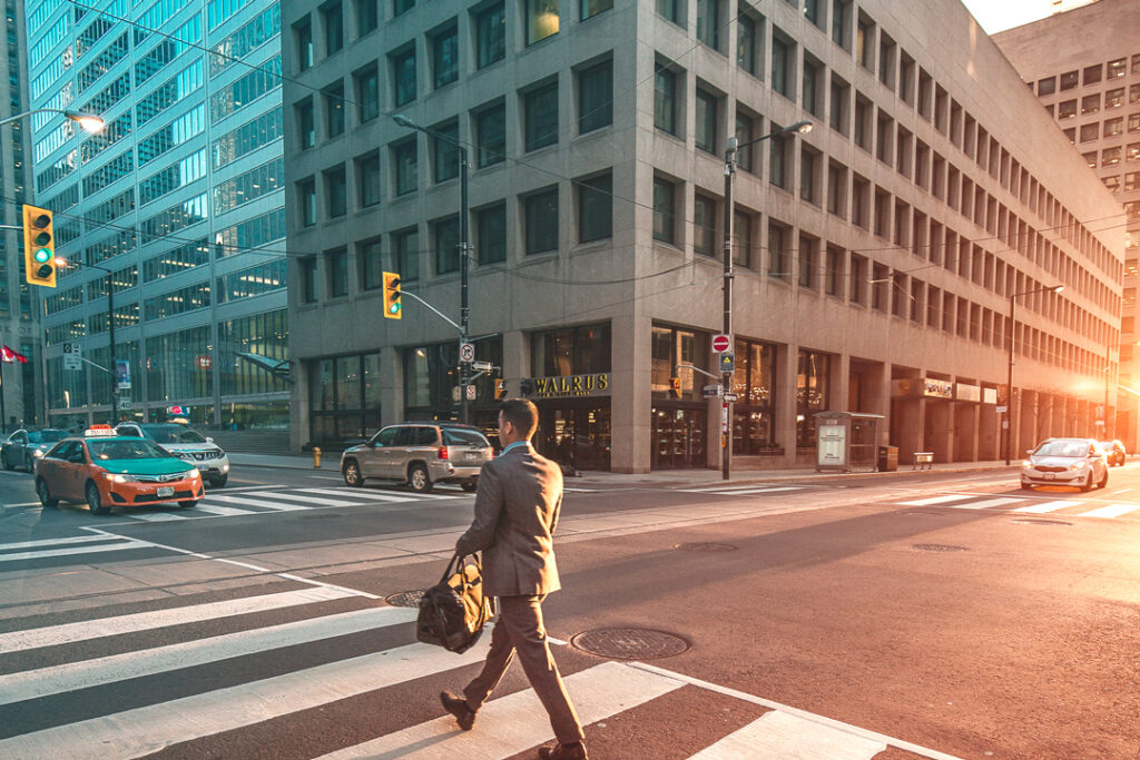 businessman walking across the street