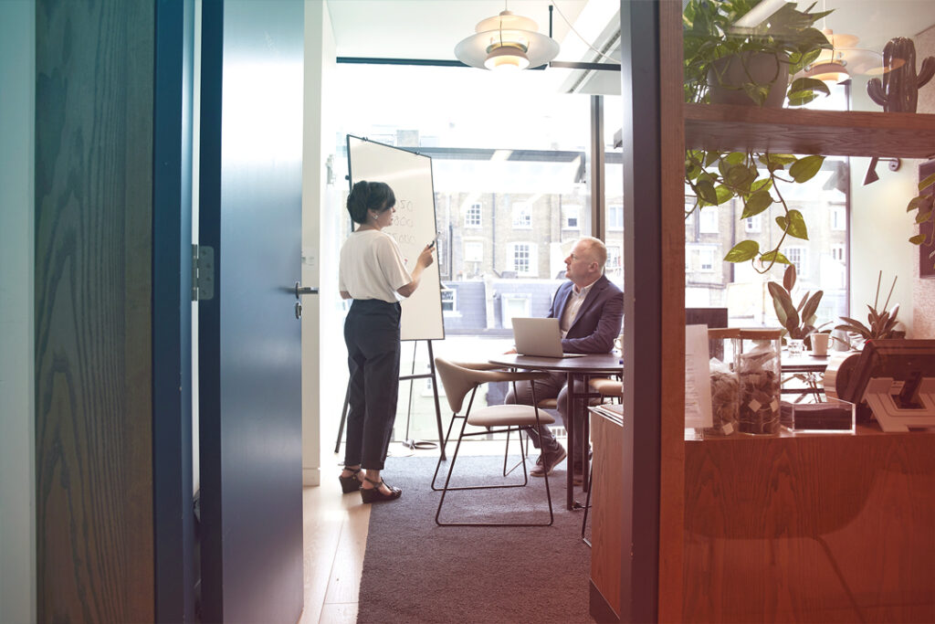Travel manager, presenting flight disruptions information to employee