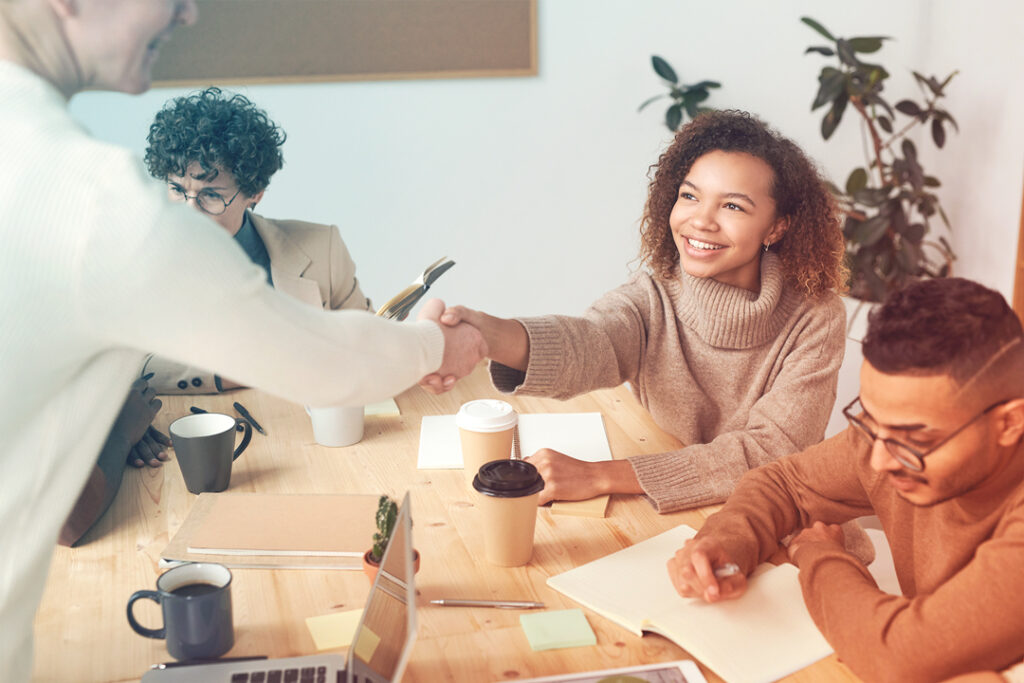 employer shaking hand of employee