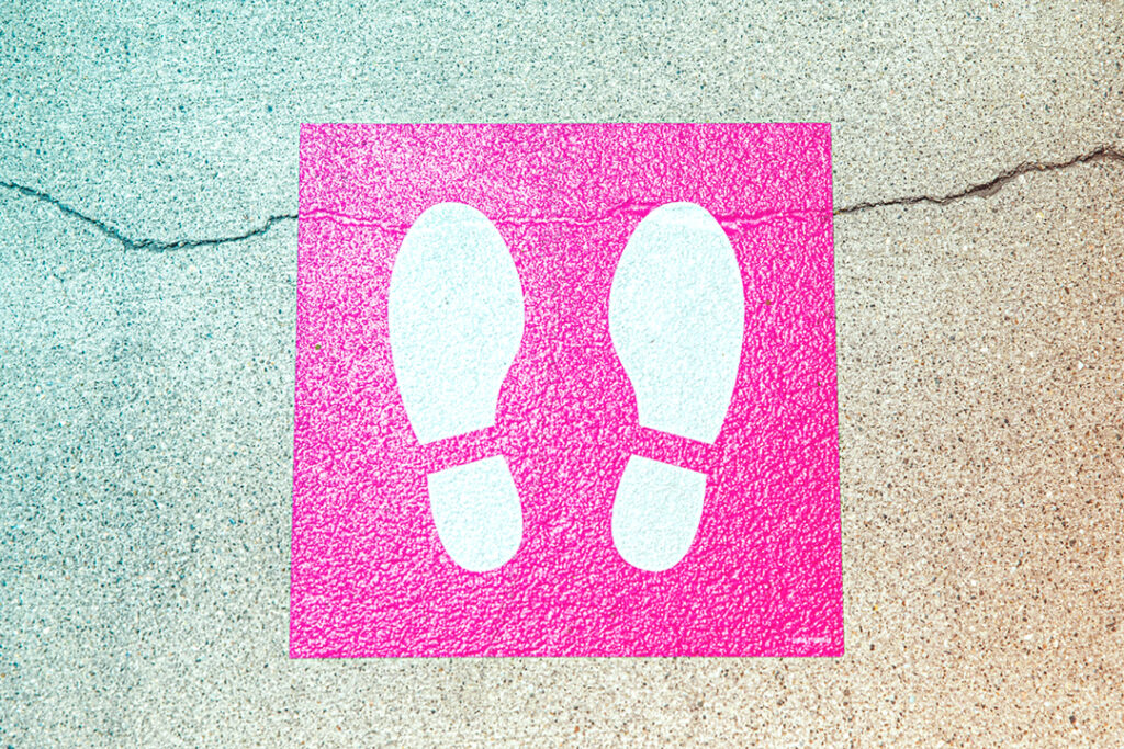 sticker of shoes on pavement