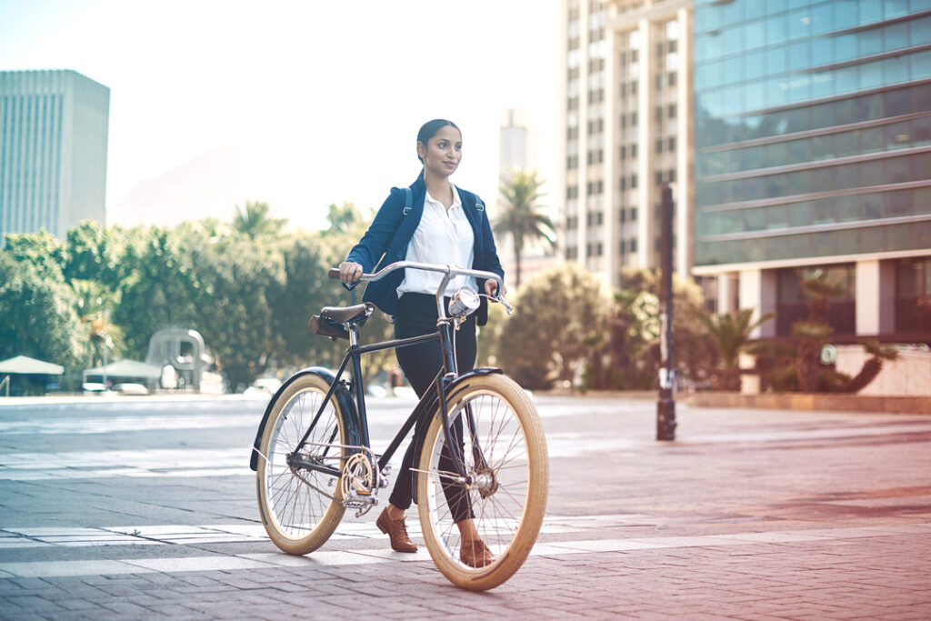 Business woman riding a bike.