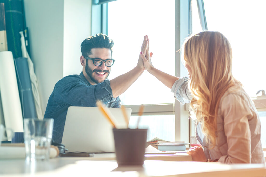 coworkers high-five