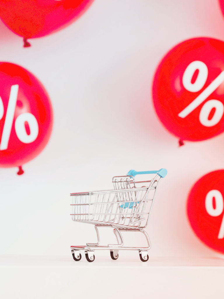 discounts symbols and toy shopping cart