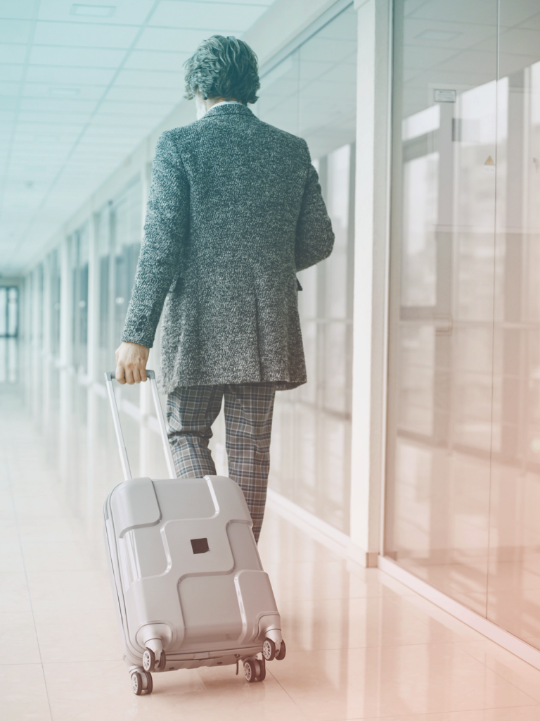 image of business Traveler on airport, carrying case