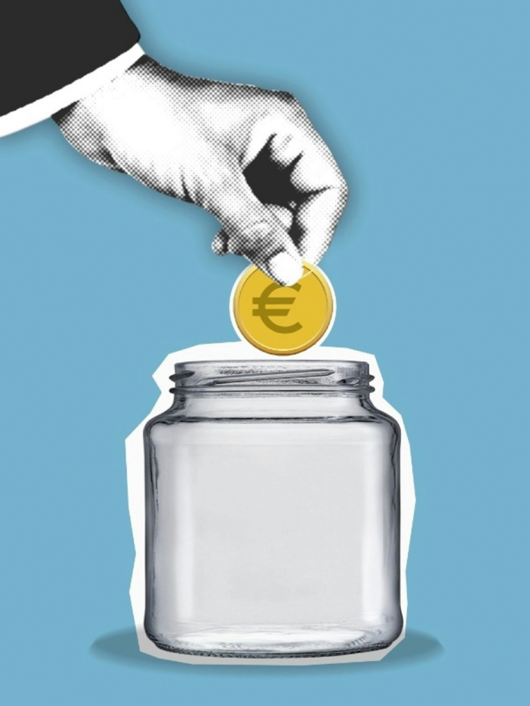 Hand putting coin in a jar representing an internal carbon fee