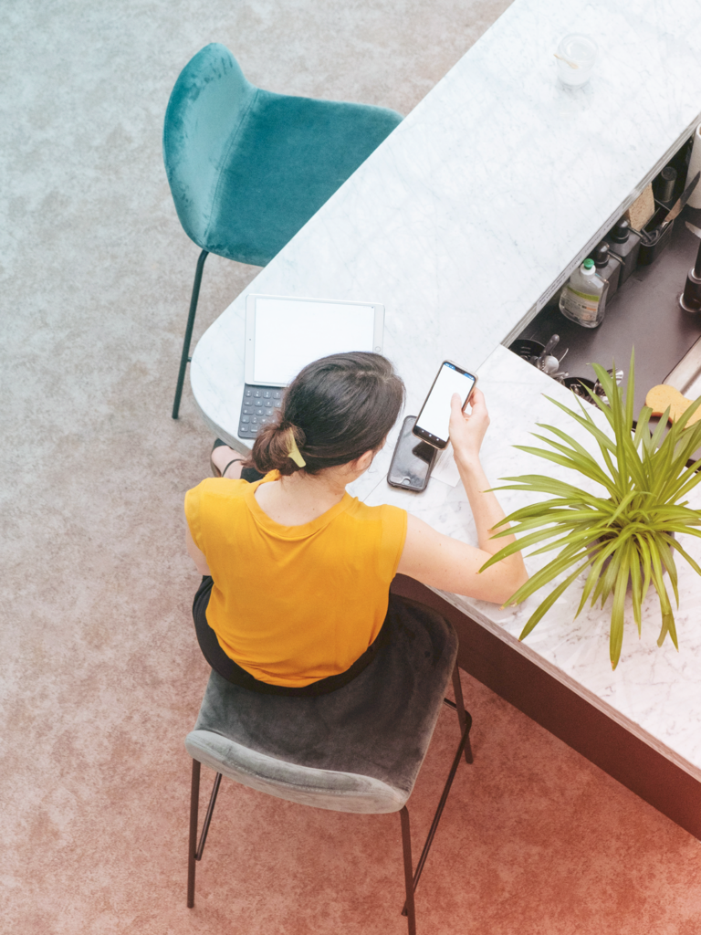 business woman working on laptop at a hotel