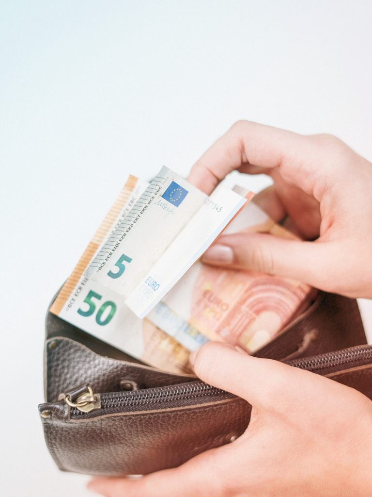 image of a business traveler opening a wallet