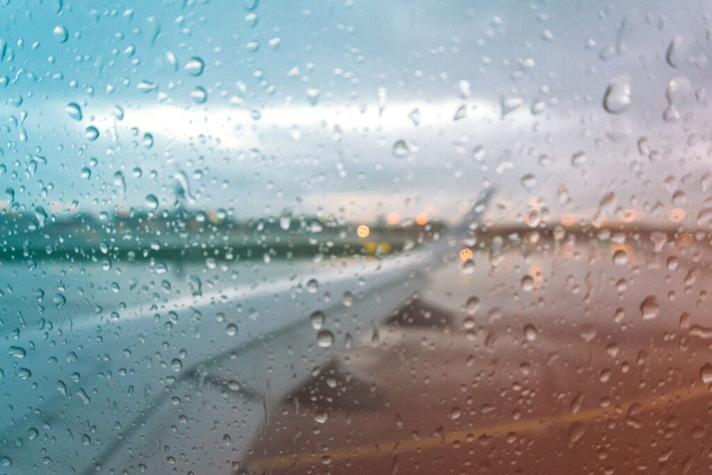 Image of a rainy airplane window