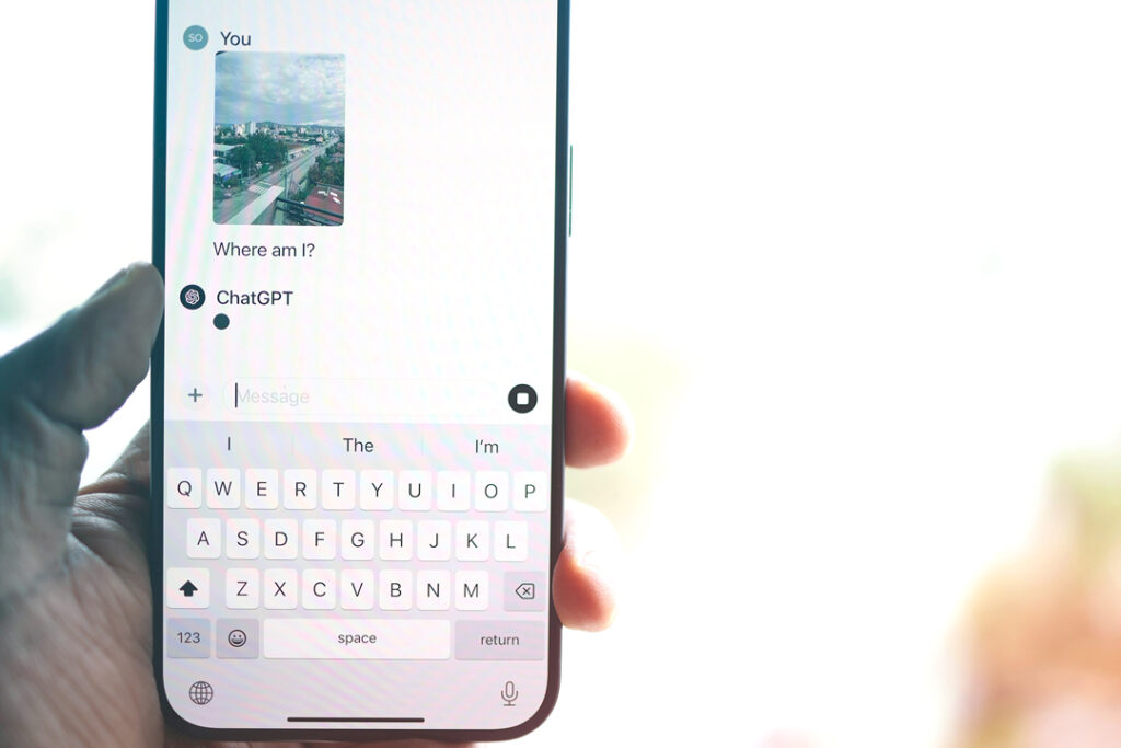 Image of a Travelers phone opened up to a ChatGPT conversation to maximize ai use
