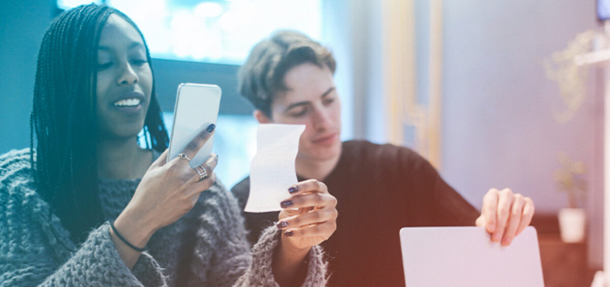 woman taking a photo of a receipt to track expenses
