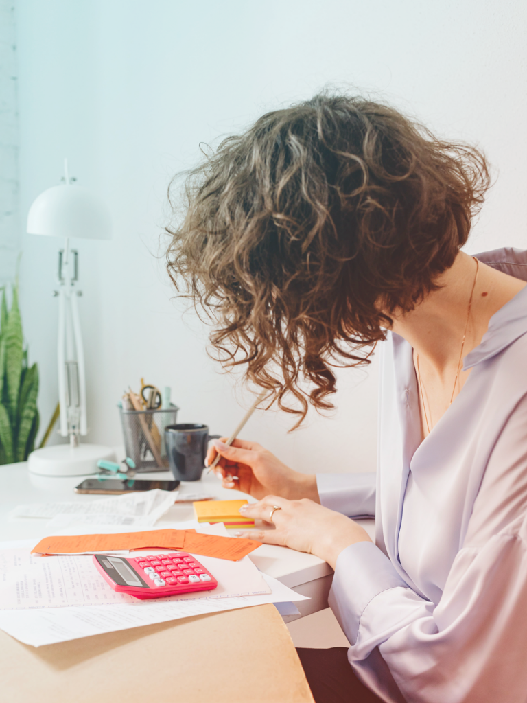 Image of a traveler, balancing travel, expense sheet.