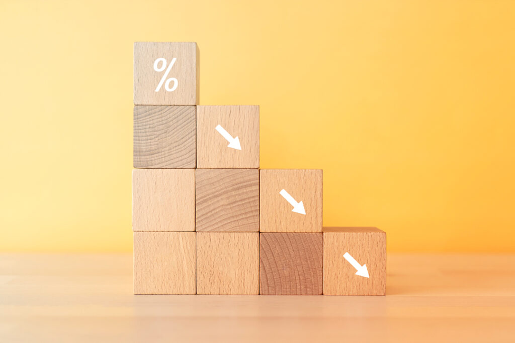 wooden blocks representing lowering costs - smart travel technology