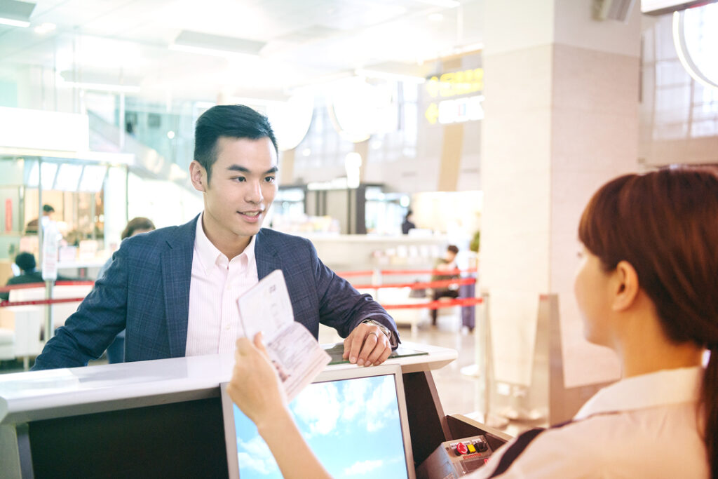Business Traveler Checking into their flight with a passport.
