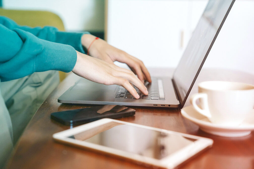 Image of a Travel Manager working on a computer.