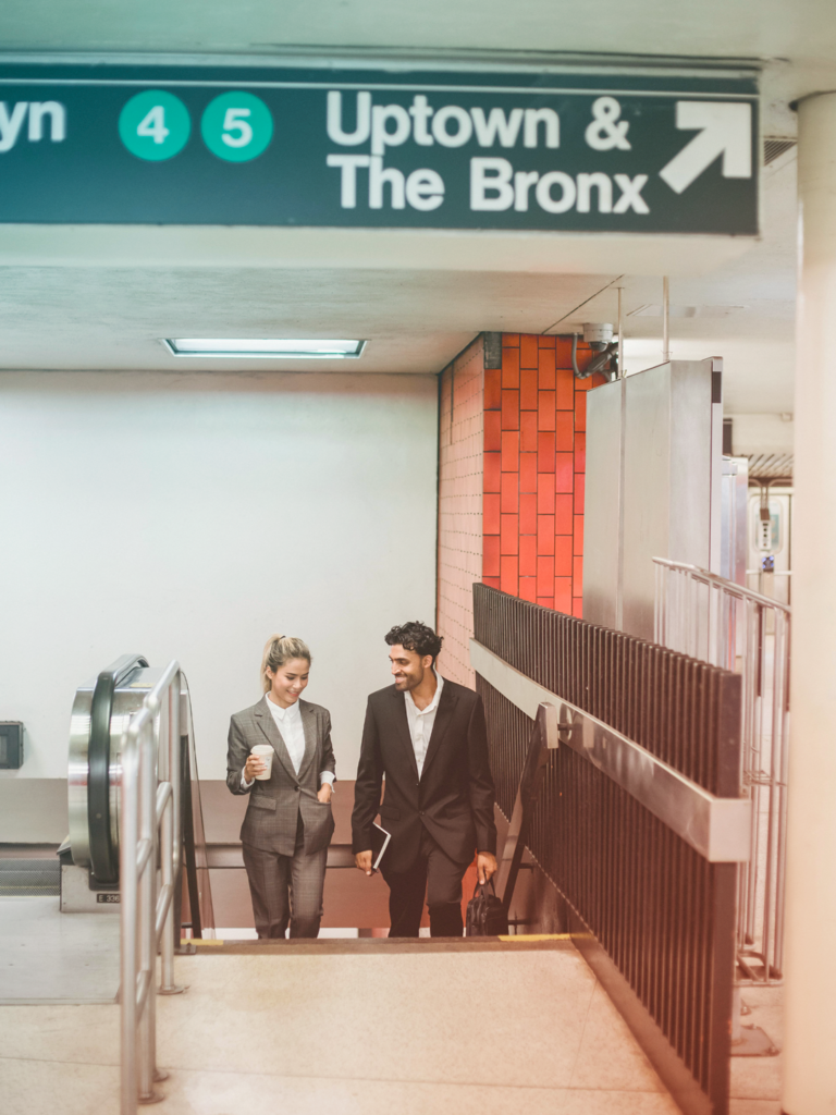 Image of two business travelers in the new York city subway