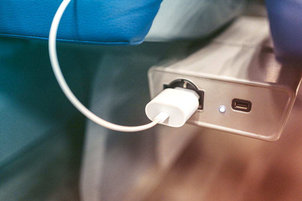 Image of a charging port on an airplane seat