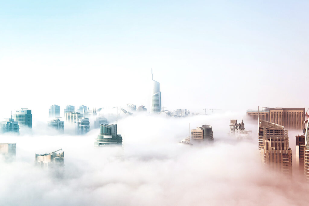 Image of a city skyline above the clouds