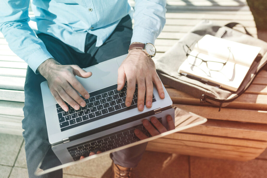 Traveler working remotly from thier laptop 