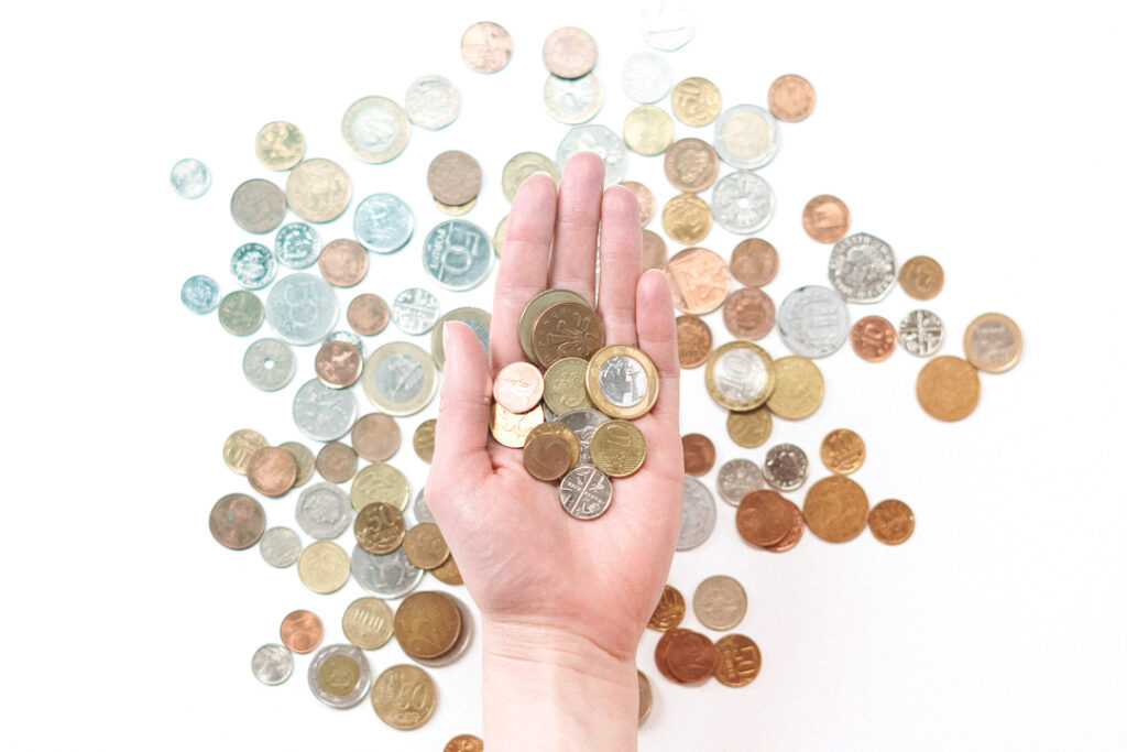 A hand full of coins.