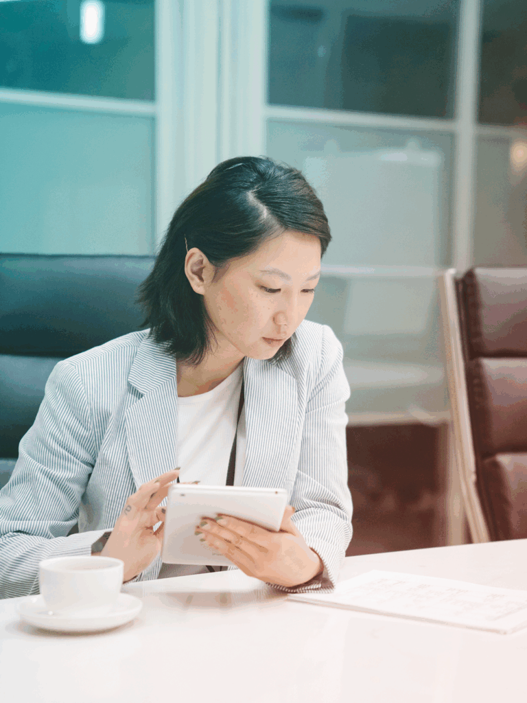 A businesswoman reviewing diffrent Travel Management services.