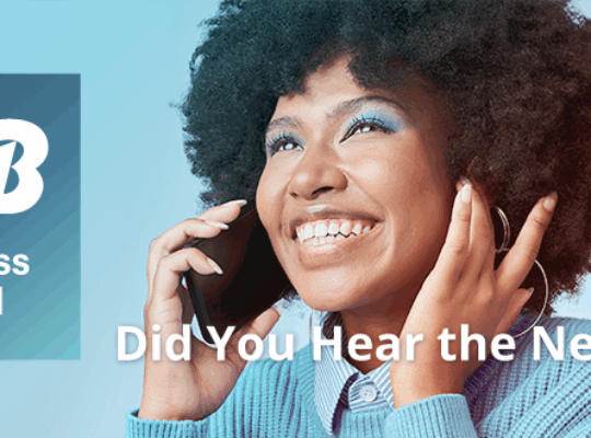 photo of woman on her cell phone with the new jtb business travel brand identity and did you hear the news? text overlay