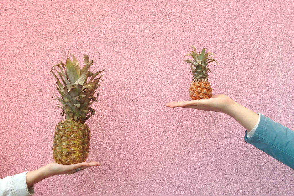 Two different people holding two different size