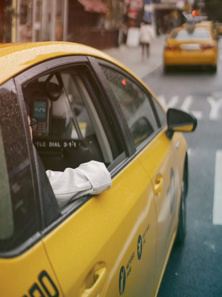 ground transportation risk management - traveler in a taxi
