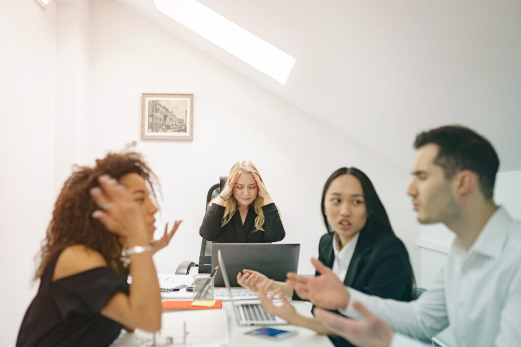 employees having a conversation around a table