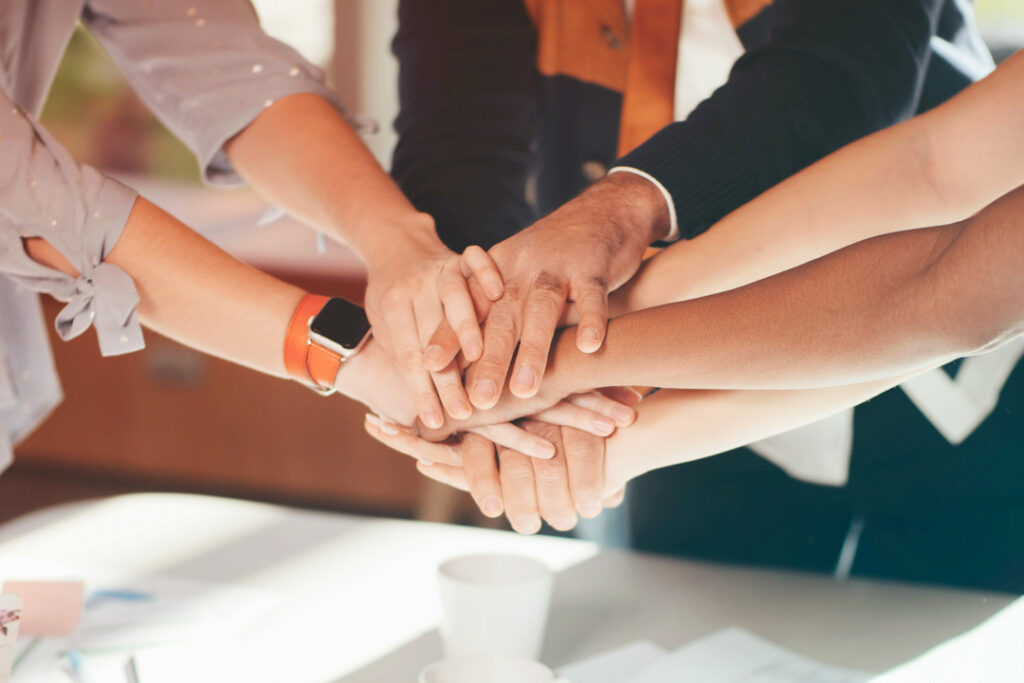 Hands in a huddle 