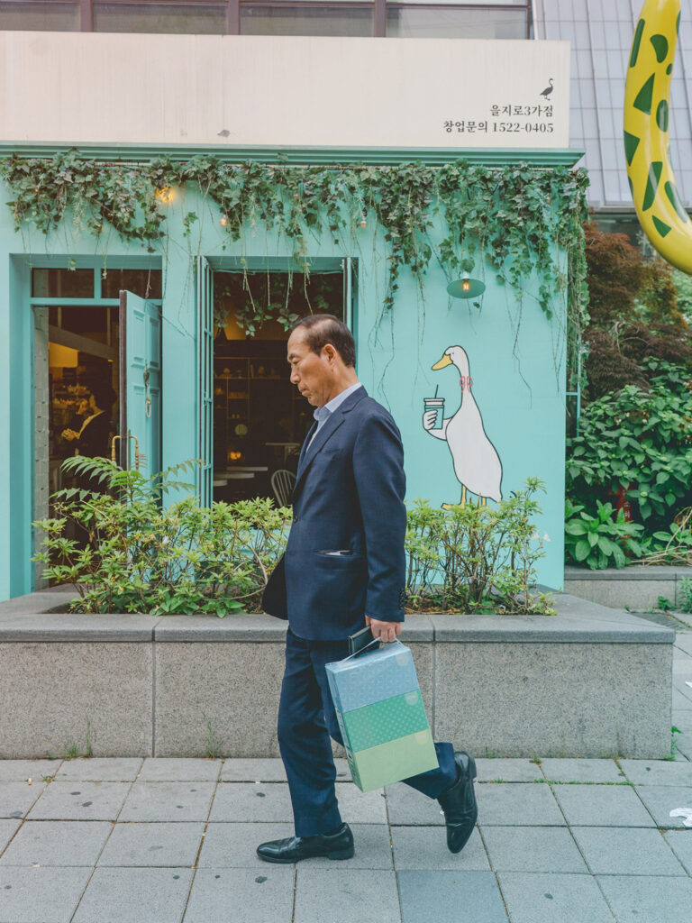 Traveler walking down the city street, enjoying a bleisure trip