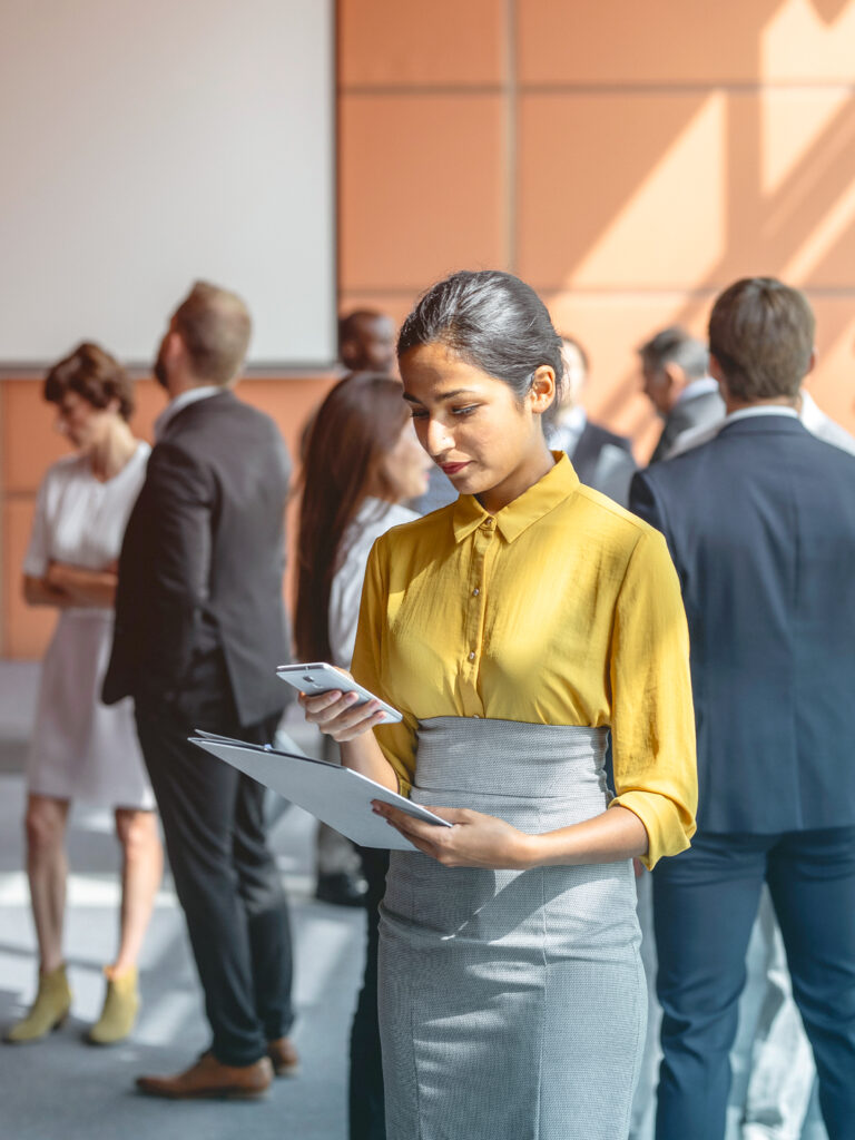 Traveler at an event following their meetings and events travel program