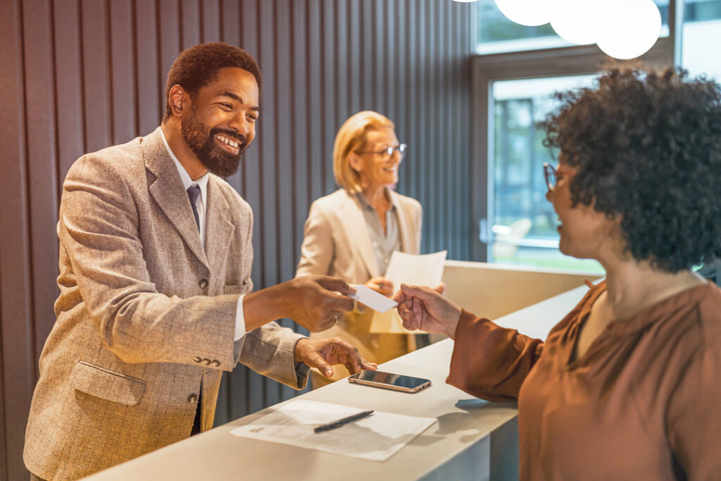 Traveler cheking into a hotel