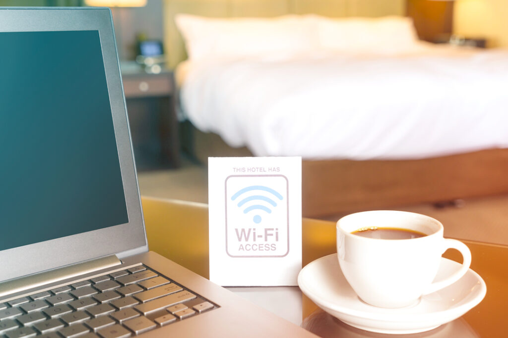 Traveler using Hotel wifi in a hotel room